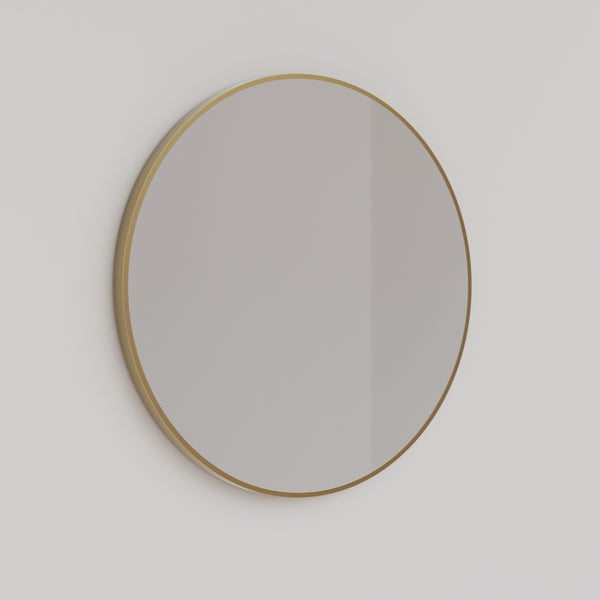 Ingrain round brushed gold framed mirror above a bathroom vanity, 800mm, wall hung