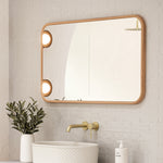 Ingrain timber framed rectangular mirror in ash finish, shown landscape in a bathroom above vanity and basin
