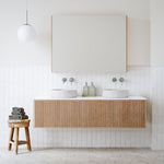 Ingrain Grooved wall hung vanity with fluted woodgrain front, white top and twin basins in a modern bathroom setting