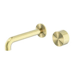 Nero Kara brushed gold wall basin/bath set with 185mm spout and round progressive handle, isolated on white