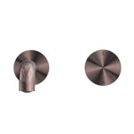 Nero Kara progressive wall basin/bath set in brushed bronze, shown front on with round wall plate and short curved spout