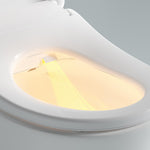 Close-up of white Lafeme bidet toilet seat showing warm water wash nozzle and illuminated bowl interior