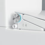 Close-up of Lafeme Thea bidet seat control dial and side buttons on a white toilet suite, showing a chrome finish and inlet pipe