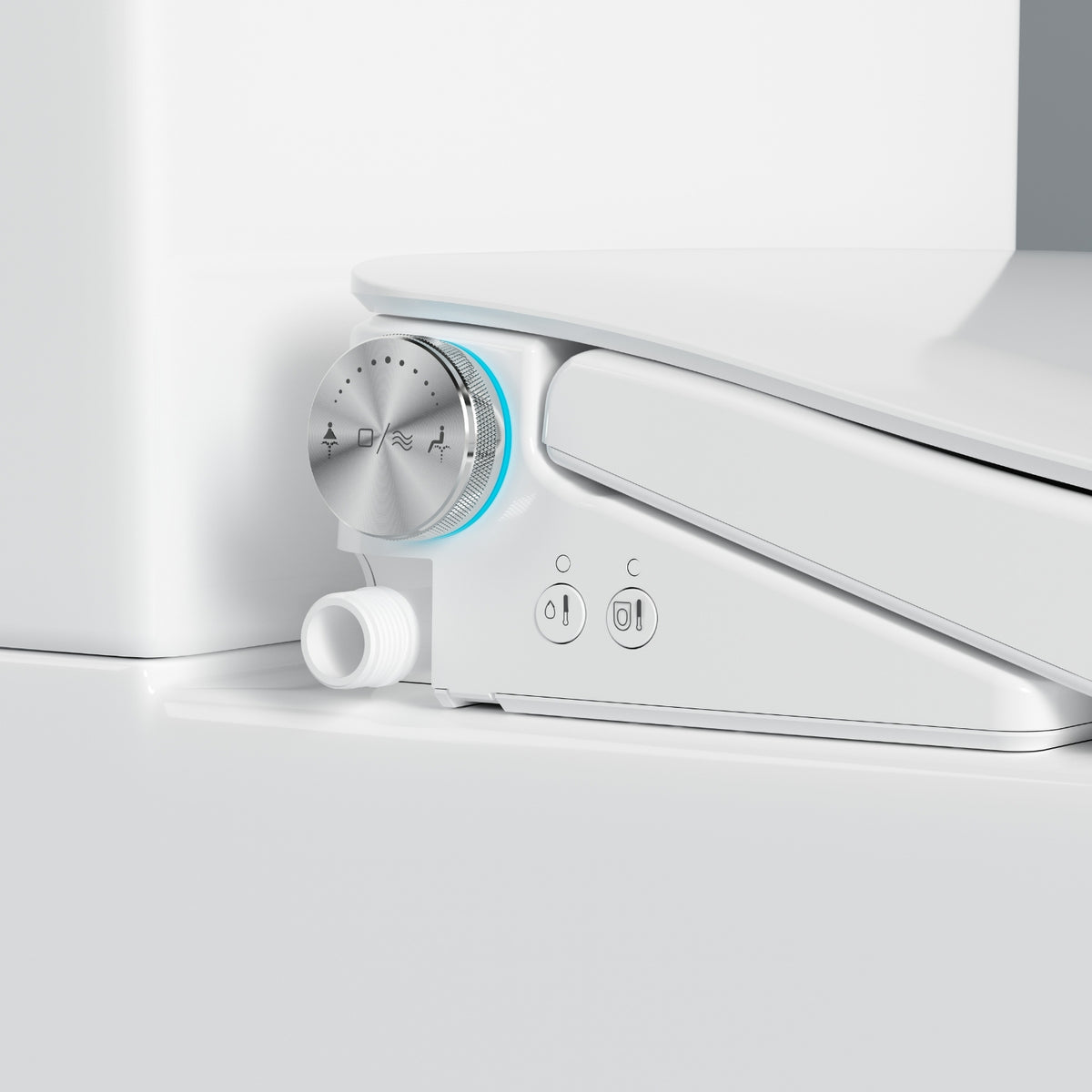 Close-up of Lafeme Thea bidet seat control dial and side buttons on a white toilet suite, showing a chrome finish and inlet pipe