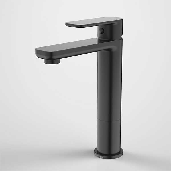 Caroma Luna tall basin mixer tap in matte black, with flat paddle handle and slim cylindrical body on a white background