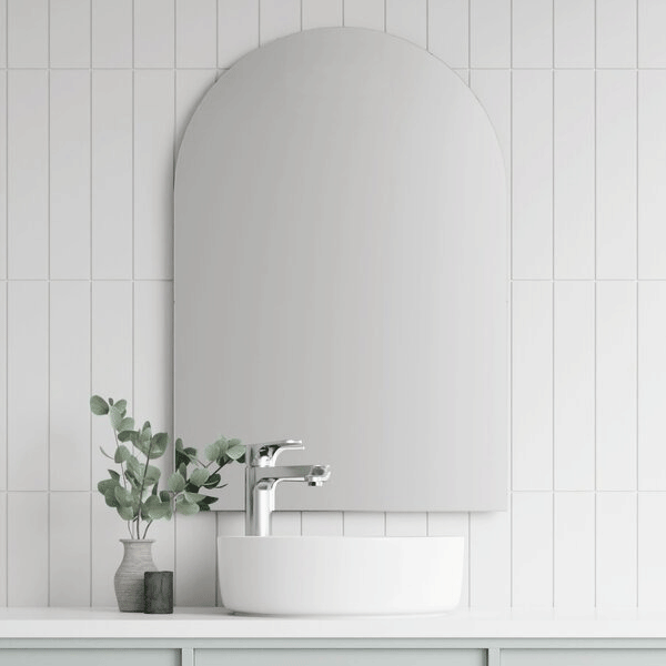 Marquis Arco arched mirror in matte white finish above a bathroom vanity with basin and chrome tapware