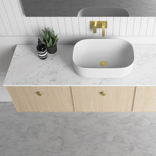 Marquis Chifley wall hung vanity in light woodgrain with marble-look benchtop, white basin and brushed brass tapware or handles