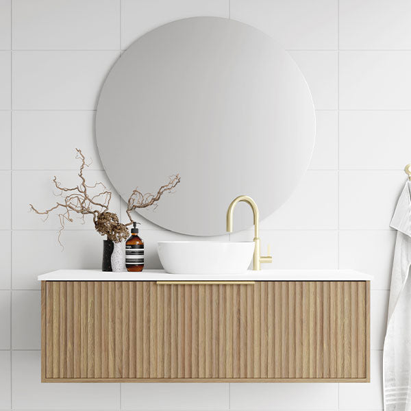 Marquis Cove wall hung vanity with fluted timber grain finish, white top and round basin in a modern bathroom setting