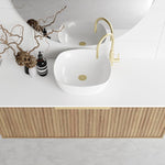 Marquis Cove wall hung vanity in Prime Oak with white benchtop, double basin and brushed brass pull handle, front view