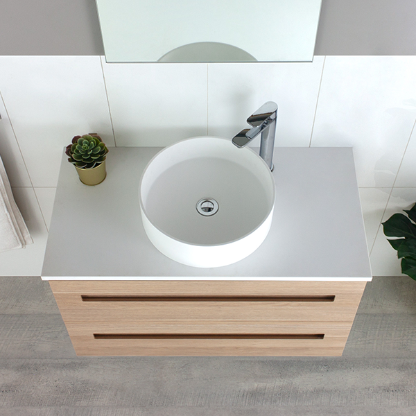 Marquis Gold wall hung vanity with natural oak drawer front, white top and round above-counter basin, front view