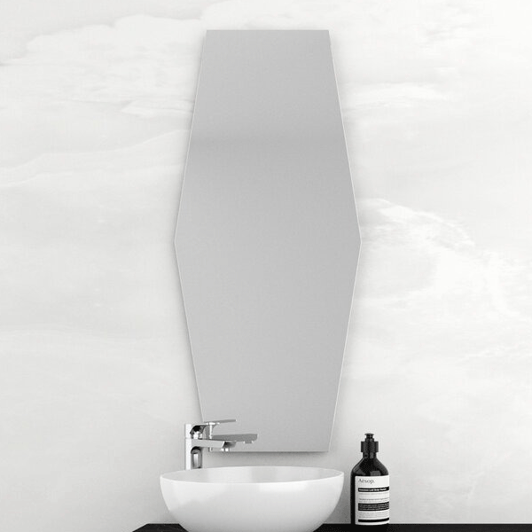 Marquis Hexa frameless mirror, tall hexagonal shape in a bathroom setting above a vanity basin