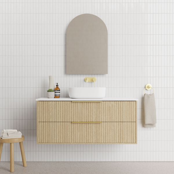 Marquis Lake wall hung vanity in coastal oak with fluted drawers, white above-counter basin and brass handles, front view