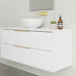 Marquis Lake wall hung vanity in white with fluted drawers, white benchtop, brass handles and round above-counter basin