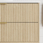 Marquis Lake wall hung vanity in coastal oak woodgrain with fluted drawer fronts and brushed brass handles, close-up view