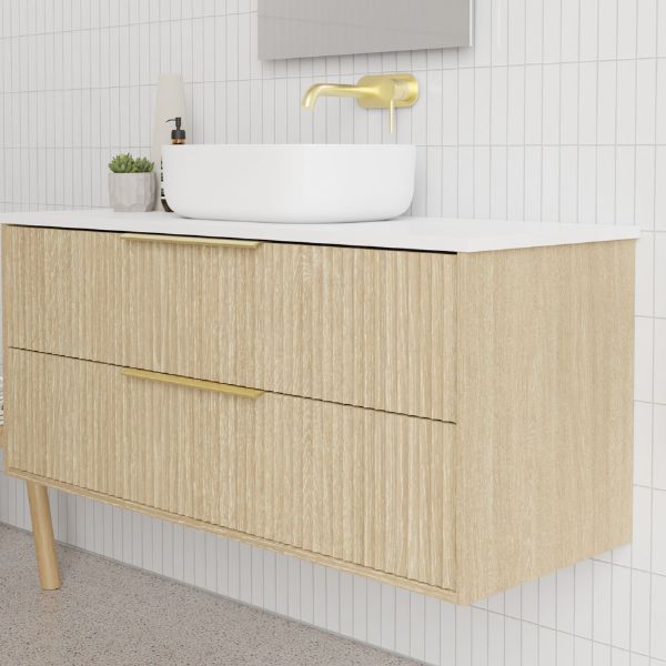 Marquis Lake wall hung vanity in coastal oak woodgrain with white benchtop, above-counter basin and brushed brass handles