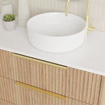 Marquis Lake floor standing vanity in coastal oak with white top, round basin and gold handles, close-up view