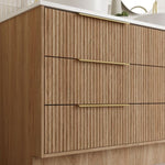 Marquis Lake floor standing vanity in coastal oak, with vertical shiplap panels and slim brass handles