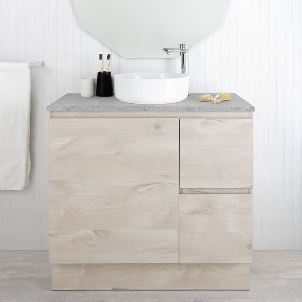 Marquis Marq floor standing vanity in light woodgrain finish with grey benchtop and round white above-counter basin