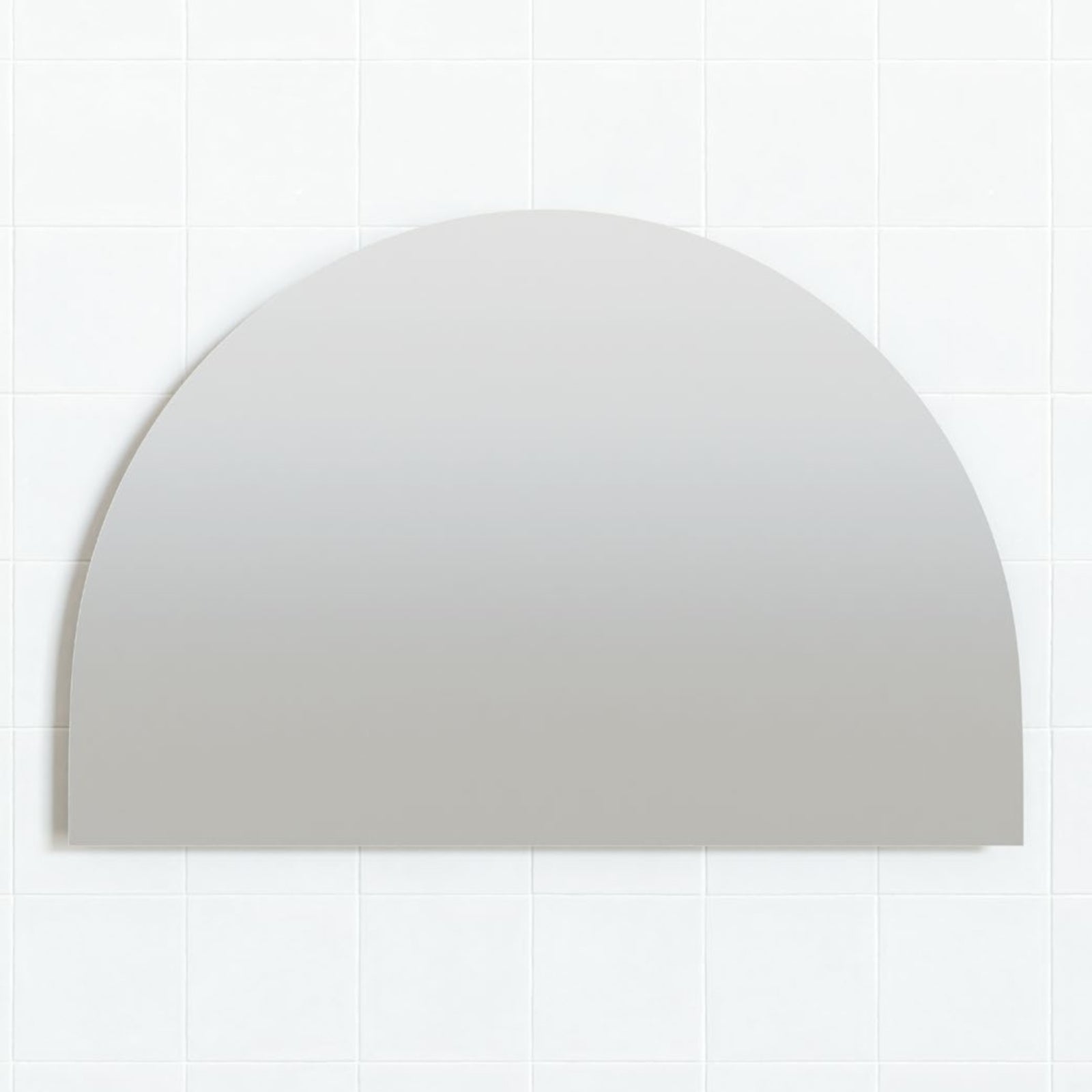 Marquis Palmer frameless arch mirror in light grey, wall-mounted against white tiled wall
