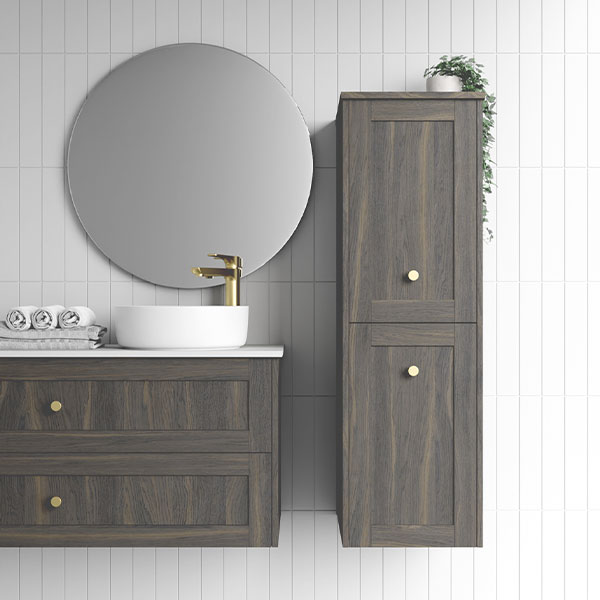 Marquis Pier wall-hung tallboy in fluted timber grain finish with brass knobs, shown beside matching vanity in a tiled bathroom