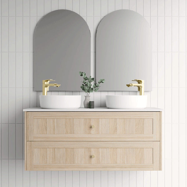 Marquis Pier wall hung vanity in natural oak with double bowls, white top and brushed brass tapware in bathroom setting