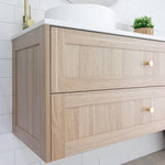 Marquis Pier wall hung vanity in natural oak finish with shaker drawers, white benchtop and brushed brass knobs