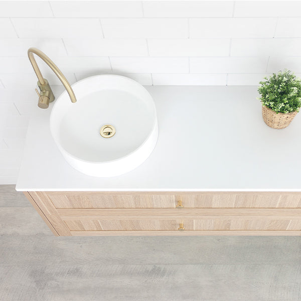 Marquis Pier wall hung vanity with white top, round basin and natural oak woodgrain drawers, angled view