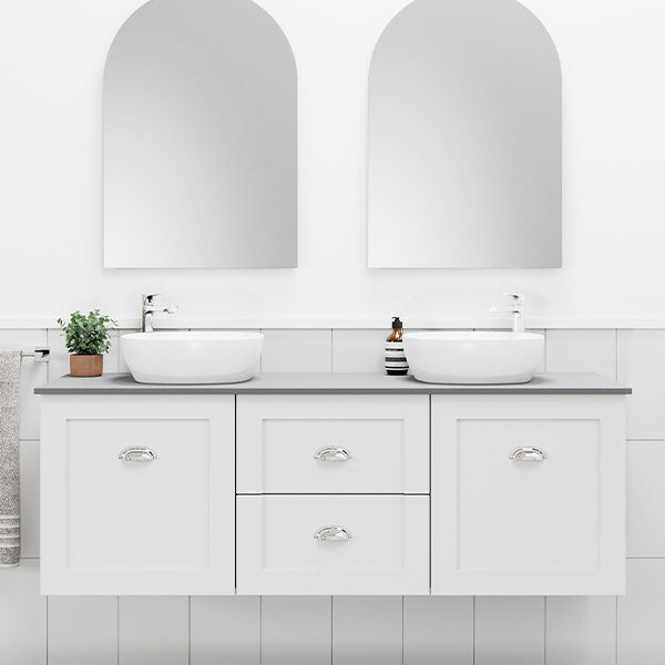 Marquis Provincial white wall hung vanity with shaker doors, grey benchtop and twin vessel basins in a bathroom setting
