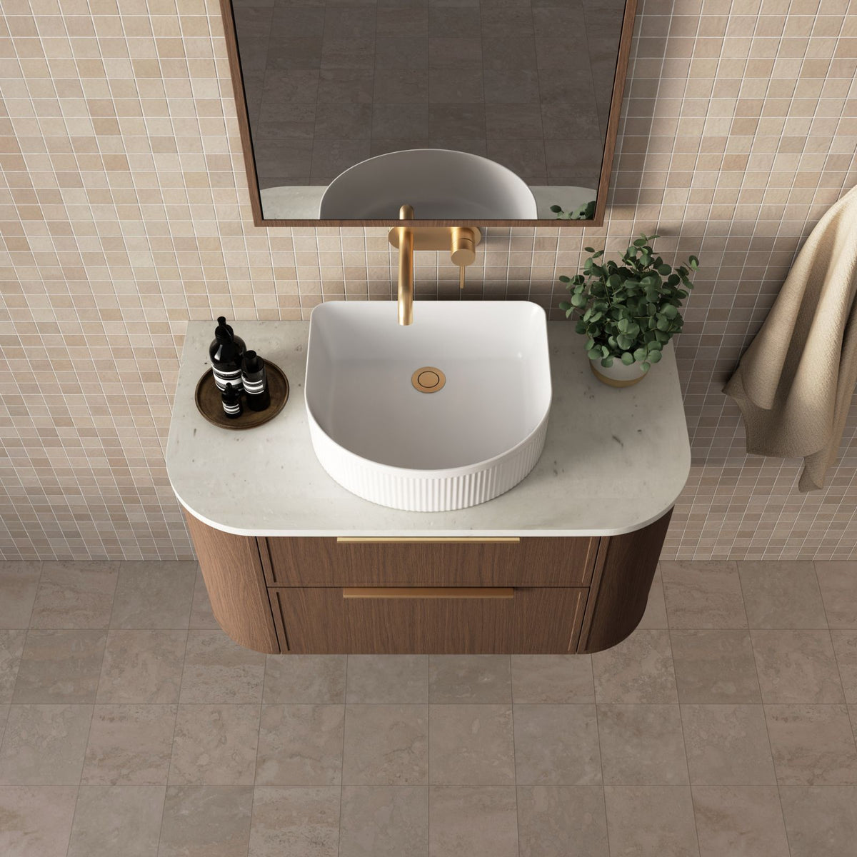Marquis Reef wall hung vanity with Symphony top, woodgrain finish, white basin and brushed brass handle in bathroom setting