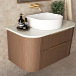 Marquis Reef wall hung vanity in woodgrain finish with white Symphony top, offset basin and brushed brass handles