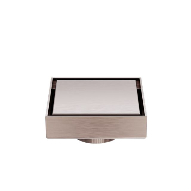 Nero square tile insert floor waste in brushed bronze with 50mm outlet, shown front on against white background
