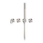 Nero Kara progressive shower system in brushed nickel with separate wall plates, hand shower and spout on white background