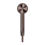 Nero Mecca Care basin mixer in brushed bronze, front view with extended handle and hot/cold markings
