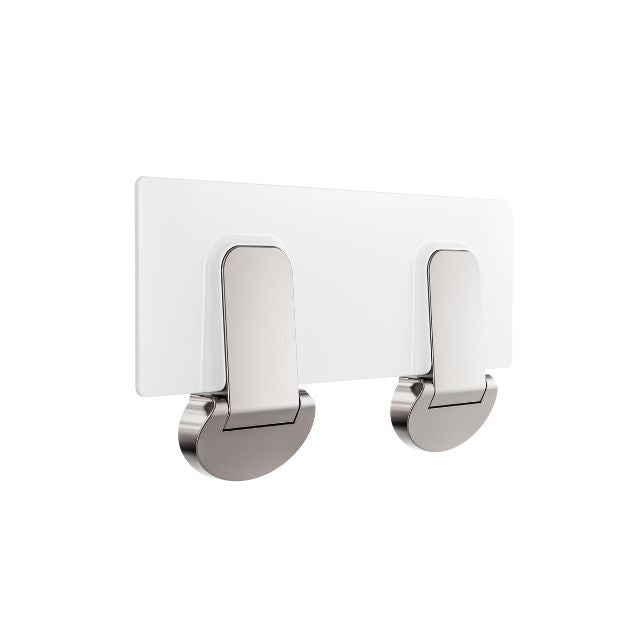 Nero Mecca Care fold-down shower seat in brushed nickel, shown folded flat against the wall