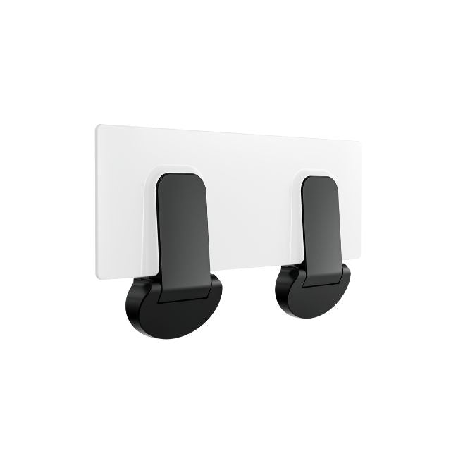 Nero Mecca Care shower seat in matte black, folded flat against a white wall bracket, rear view