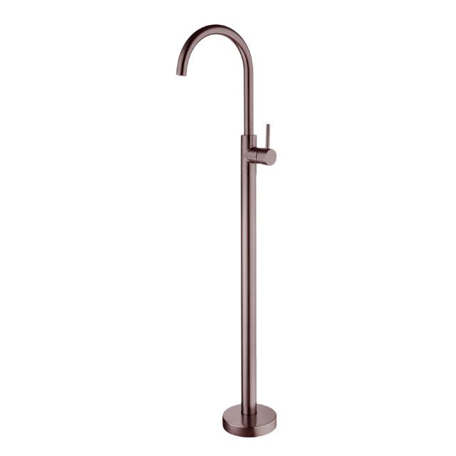Nero Mecca freestanding bath mixer in brushed bronze, floor mounted with tall curved spout and round base