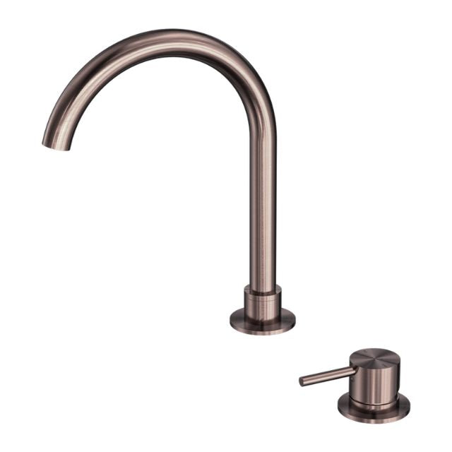 Nero Mecca hob basin mixer in brushed bronze with round swivel spout and matching single lever handle, shown on white background