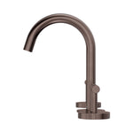 Nero Mecca arc basin set in brushed bronze, with curved spout and lever handle on a white background