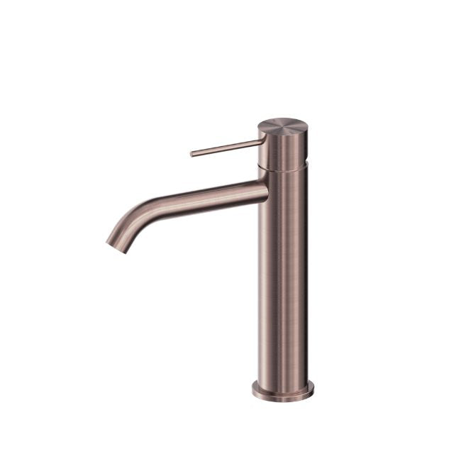 Nero Mecca mid tall basin mixer in brushed bronze, side view with cylindrical body and curved spout