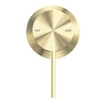 Nero Mecca shower mixer with 60mm round plate in brushed gold, wall-mounted tap shown front on with hot and cold markings