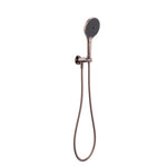 Nero Mecca hand shower on bracket in brushed bronze, wall-mounted with flexible hose on a white background