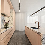 Brushed bronze Nero pull-out kitchen mixer over a marble island sink in a modern light timber kitchen