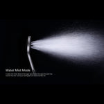 Nero Mecca twin shower handset in brushed bronze, shown in water mist mode on black background