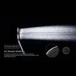 Nero Mecca Air Shower mode close-up, showing a soft spray from the brushed bronze twin shower head on a black background