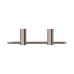 Nero New Mecca towel ring in brushed bronze, front view, with twin cylindrical wall mounts on a white background