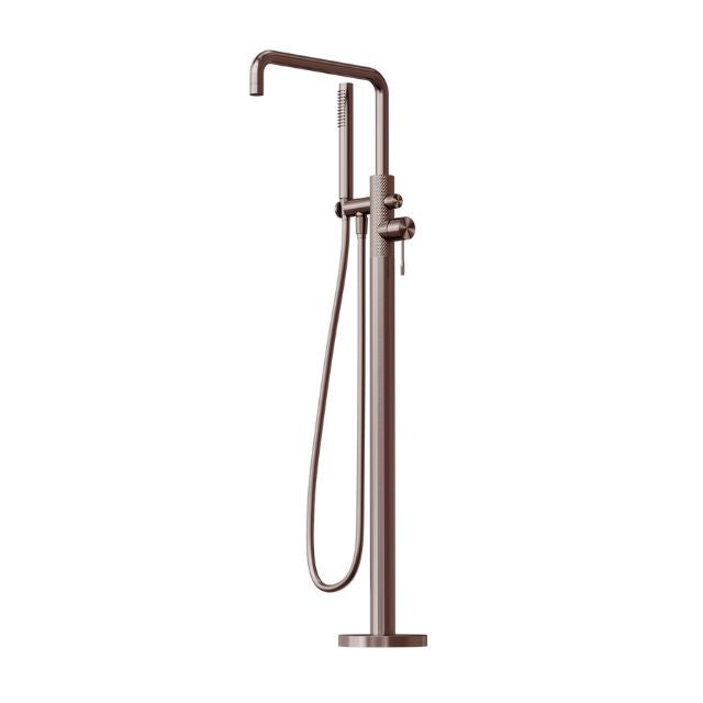 Nero Opal freestanding bath mixer with hand shower in brushed bronze, floor-mounted tap on white background