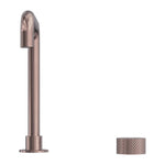Nero Opal Progressive tall basin spout in brushed bronze, shown with matching textured hand wheel on white background