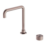Nero Opal progressive tall basin spout in brushed bronze with separate knurled control knob on white background