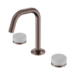Nero Serenity basin set with edge spout in brushed bronze and white Carrara marble handles, isolated on white