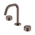 Nero Serenity brushed bronze 3-piece basin tap set with edge spout and two metal handles on white background